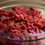 grind meat in glass bowl